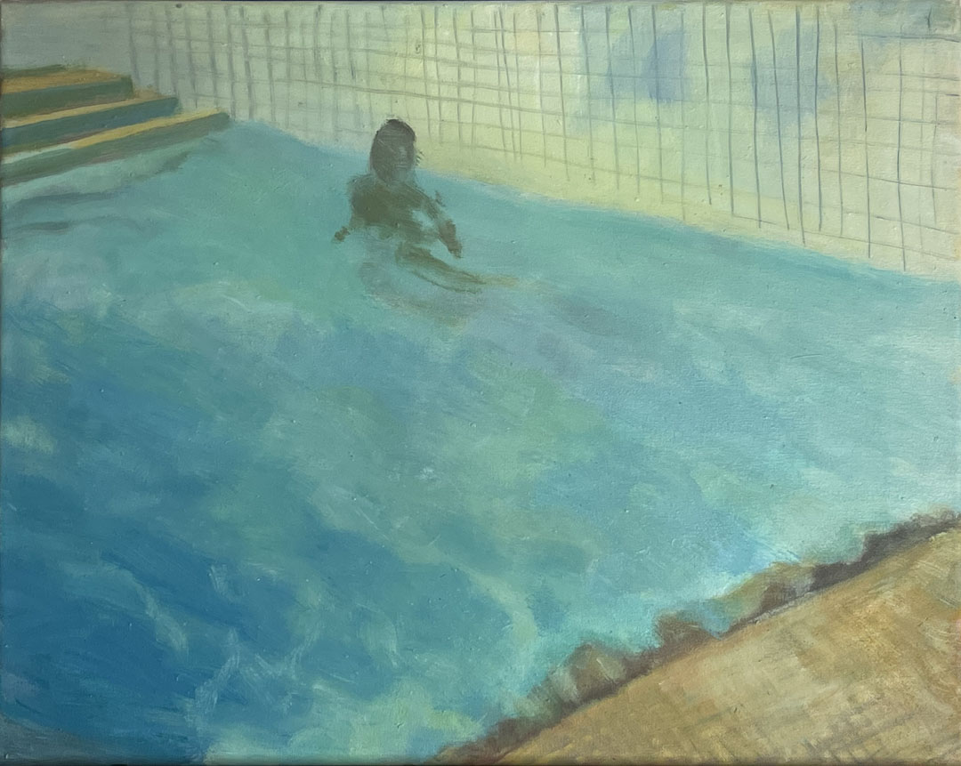 Boy against the pool wall